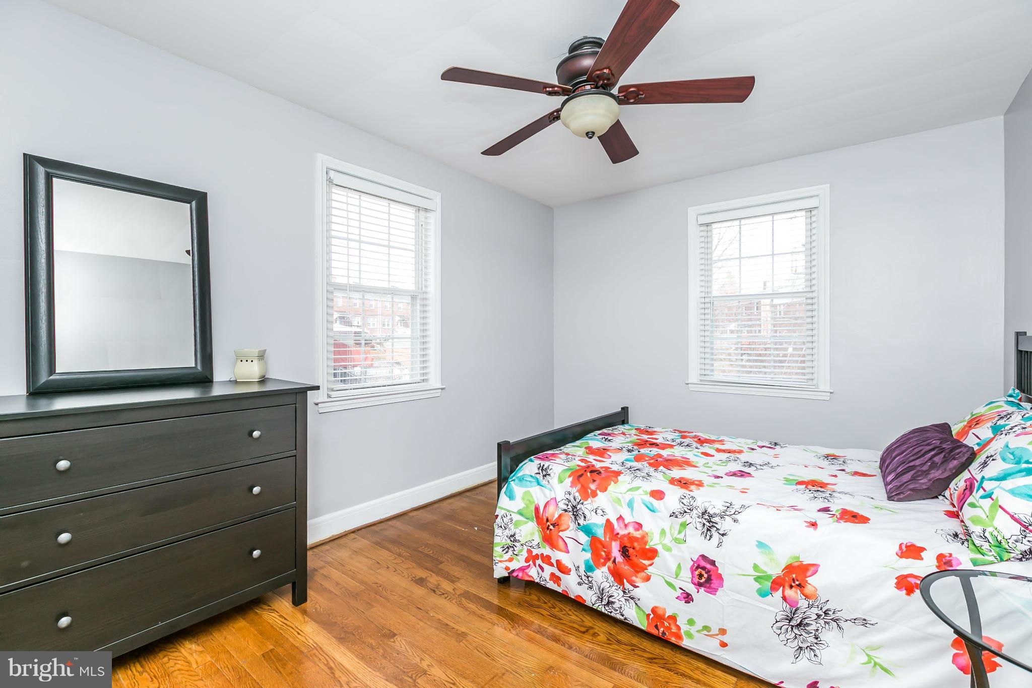 1947 Edgewood Road Baltimore, MD 21286 - Photo 18 of 28 a bedroom with a bed and a dresser in it