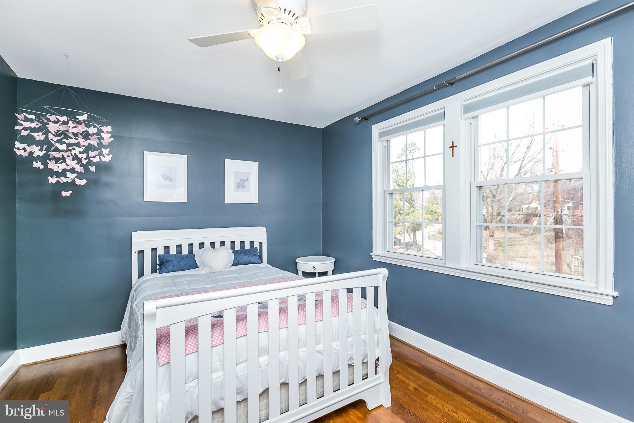 1947 Edgewood Road Baltimore, MD 21286 - Photo 19 of 28 a bedroom with a bed and a large window
