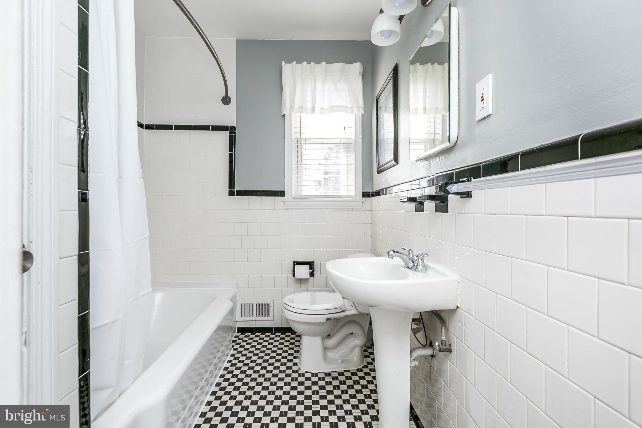 1947 Edgewood Road Baltimore, MD 21286 - Photo 20 of 28 a bathroom with a sink toilet and a mirror