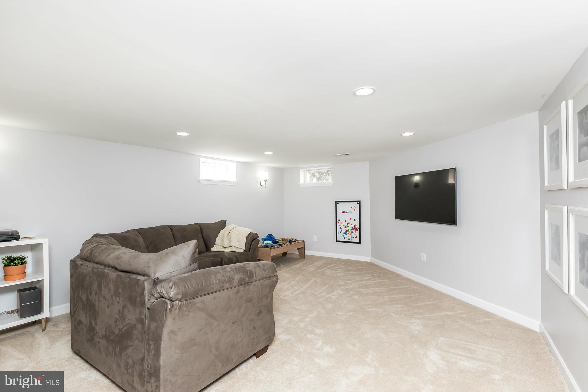 1947 Edgewood Road Baltimore, MD 21286 - Photo 23 of 28 a living room with furniture and a flat screen tv
