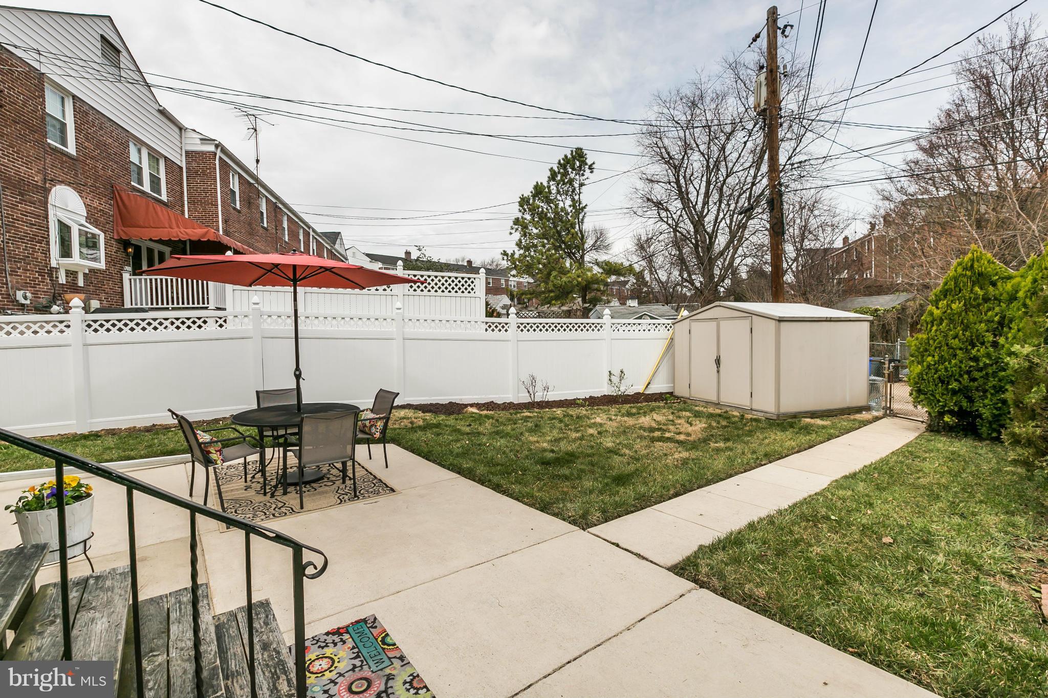 1947 Edgewood Road Baltimore, MD 21286 - Photo 25 of 28 a view of a patio with table and chairs with wooden fence and plants