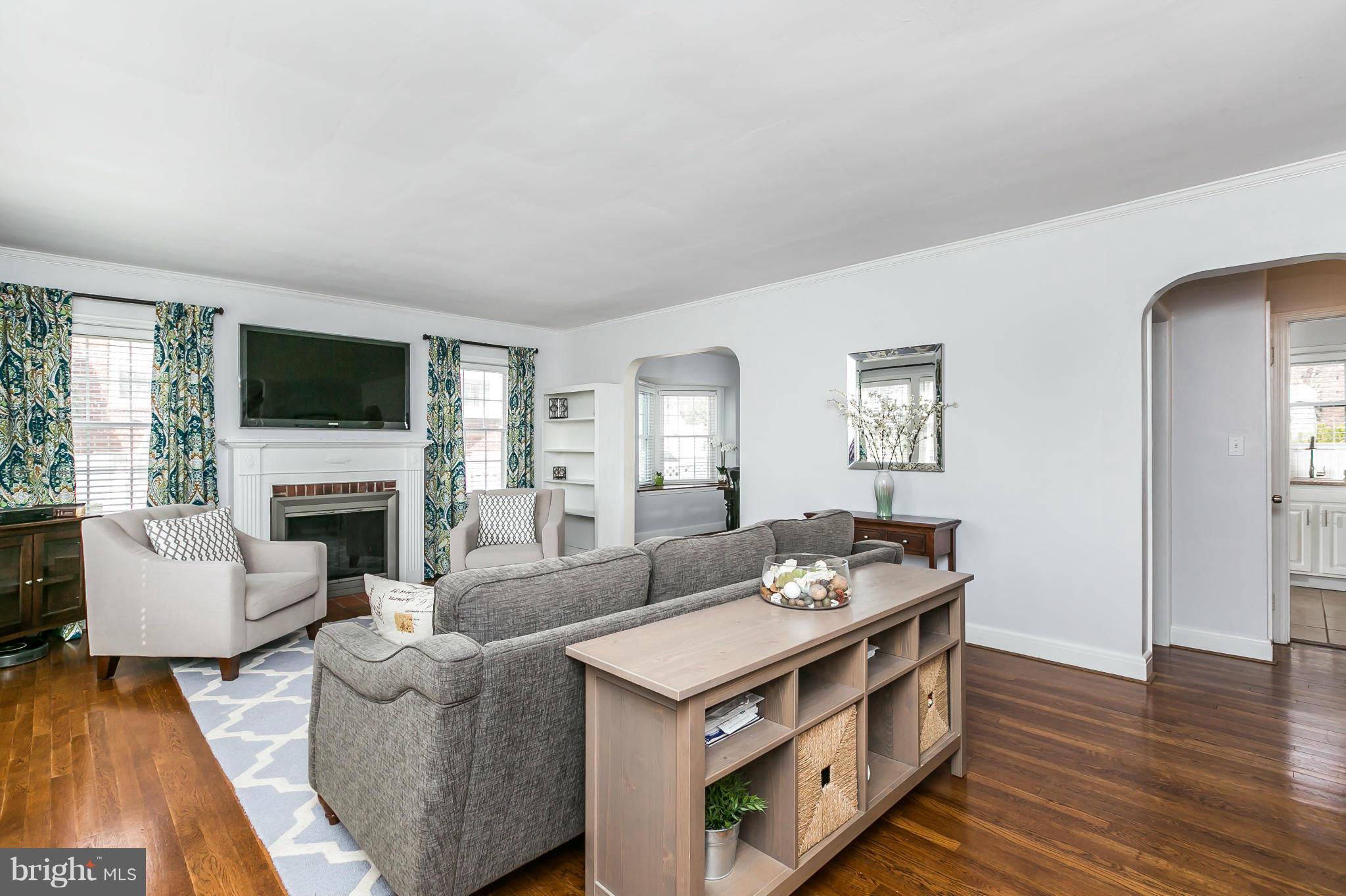 1947 Edgewood Road Baltimore, MD 21286 - Photo 8 of 28 a living room with furniture a fireplace and a flat screen tv