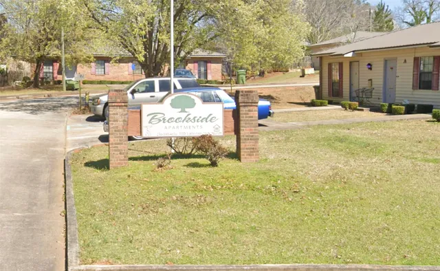 a sign that is on the side of a road