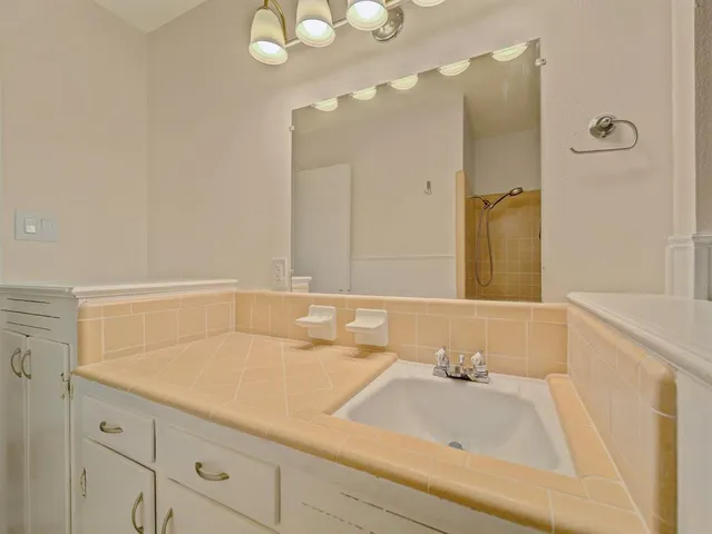 a bathroom with a sink and a mirror