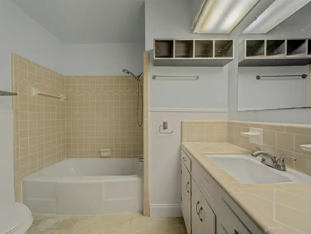 a bathroom with a sink and a bathtub