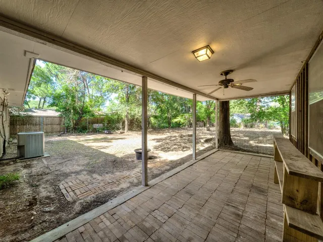 a view of a porch and garden