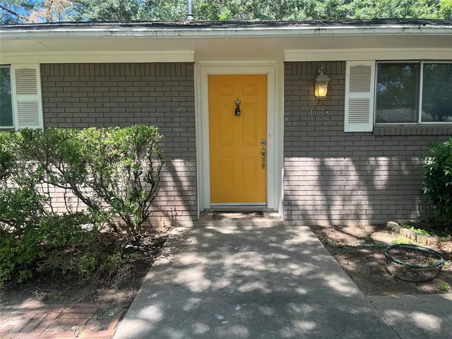 a view of a house with a small yard