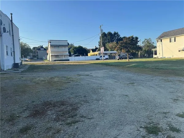 a view of a big yard with a house