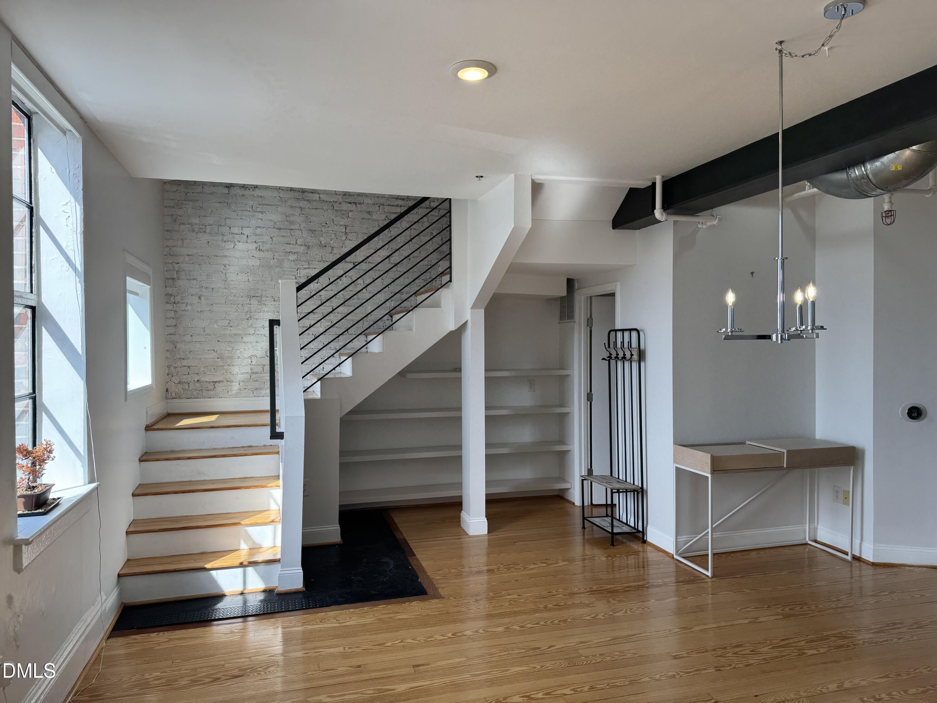 109 West Main Street, Unit 402 Durham, NC 27701 - Photo 5 of 19 a view of entryway and hall with wooden floor