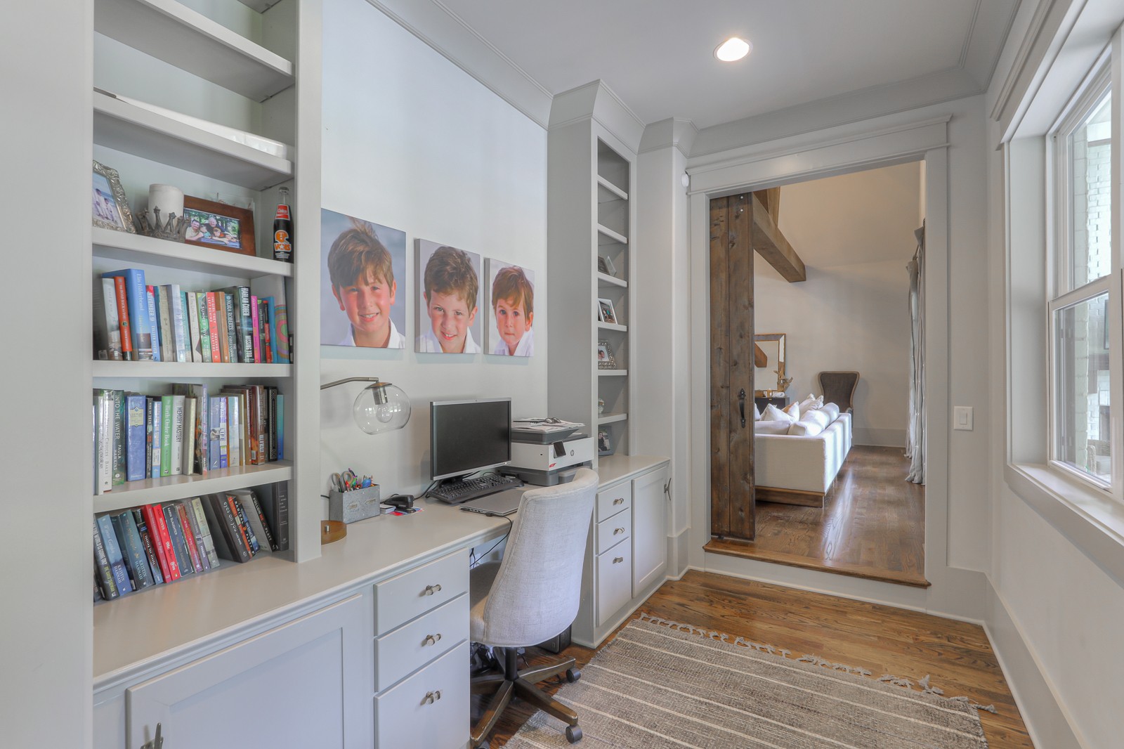 4554 Peytonsville Road Franklin, TN 37064 - Photo 15 of 29 a view of a workspace with furniture and a book shelf