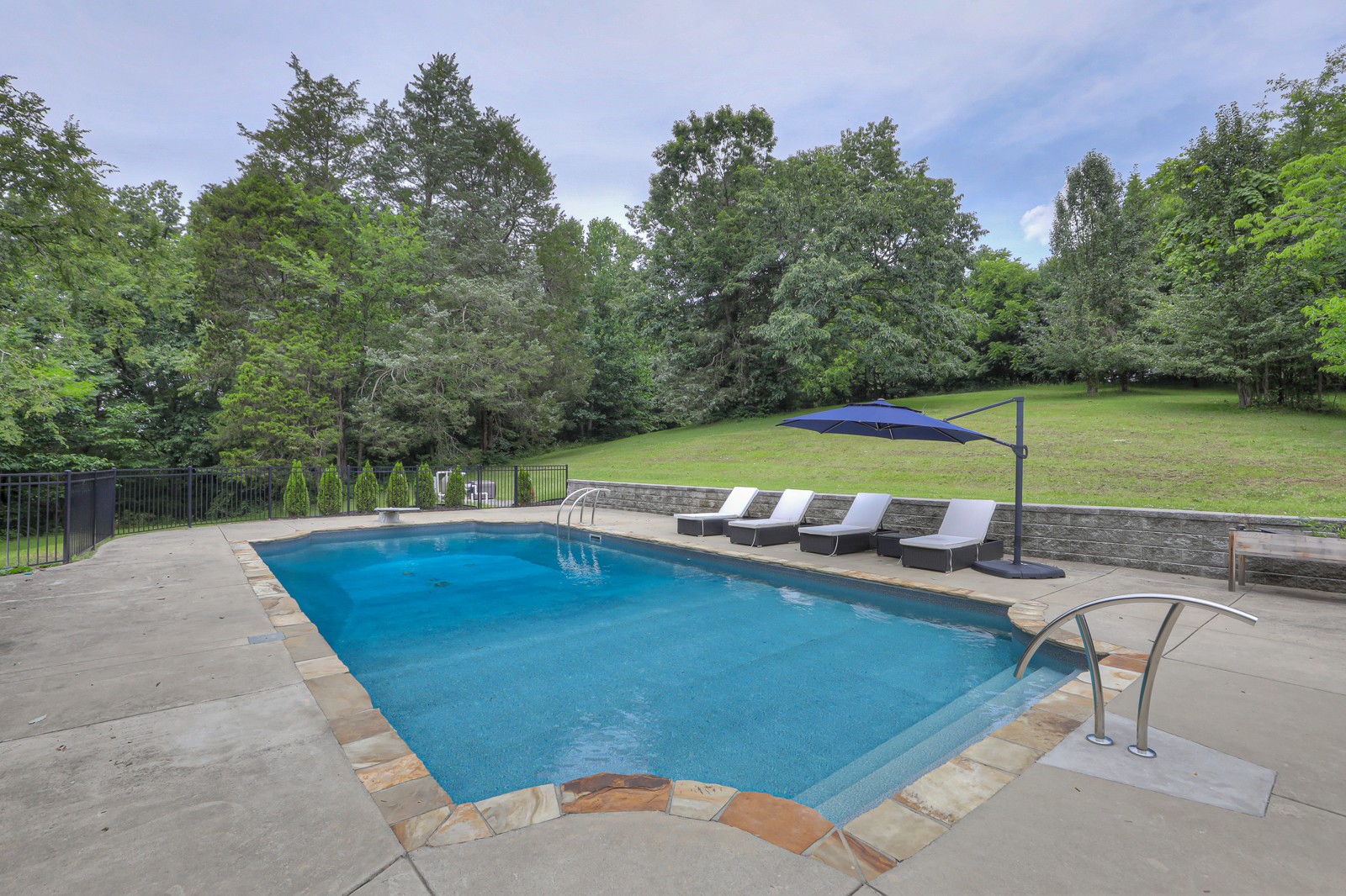 4554 Peytonsville Road Franklin, TN 37064 - Photo 27 of 29 a view of a swimming pool with a yard