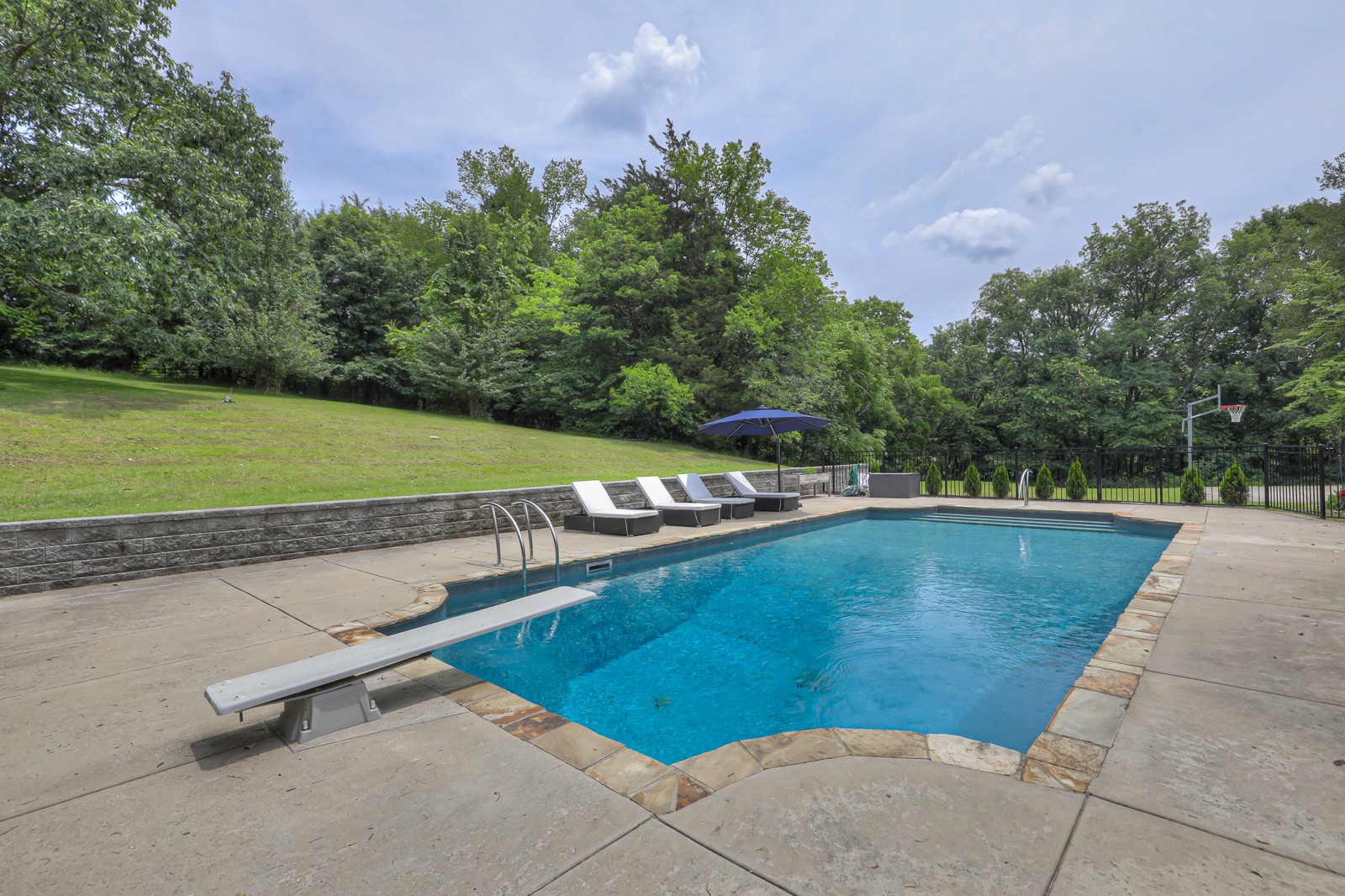 4554 Peytonsville Road Franklin, TN 37064 - Photo 28 of 29 a view of a swimming pool with an outdoor space and seating area