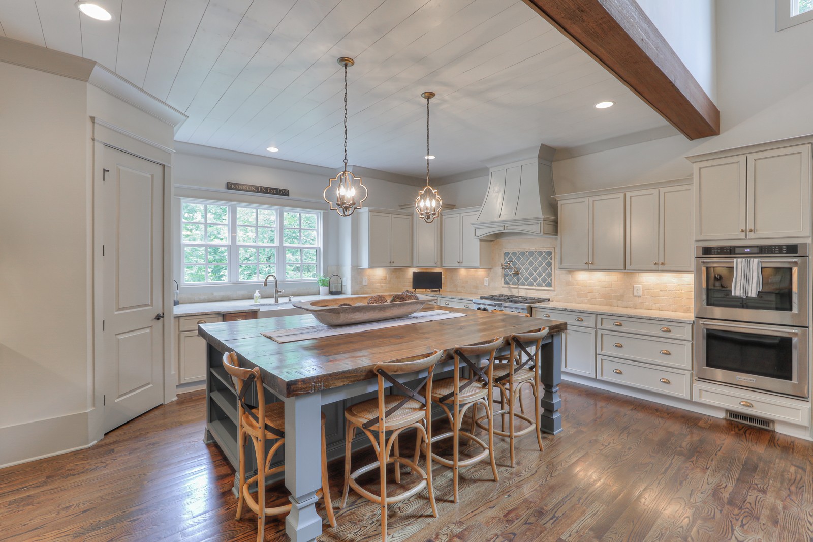 4554 Peytonsville Road Franklin, TN 37064 - Photo 8 of 29 a kitchen with granite countertop a stove a sink a counter space and wooden floor
