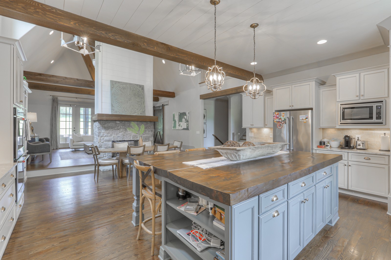 4554 Peytonsville Road Franklin, TN 37064 - Photo 9 of 29 a kitchen with kitchen island a large counter space appliances and cabinets