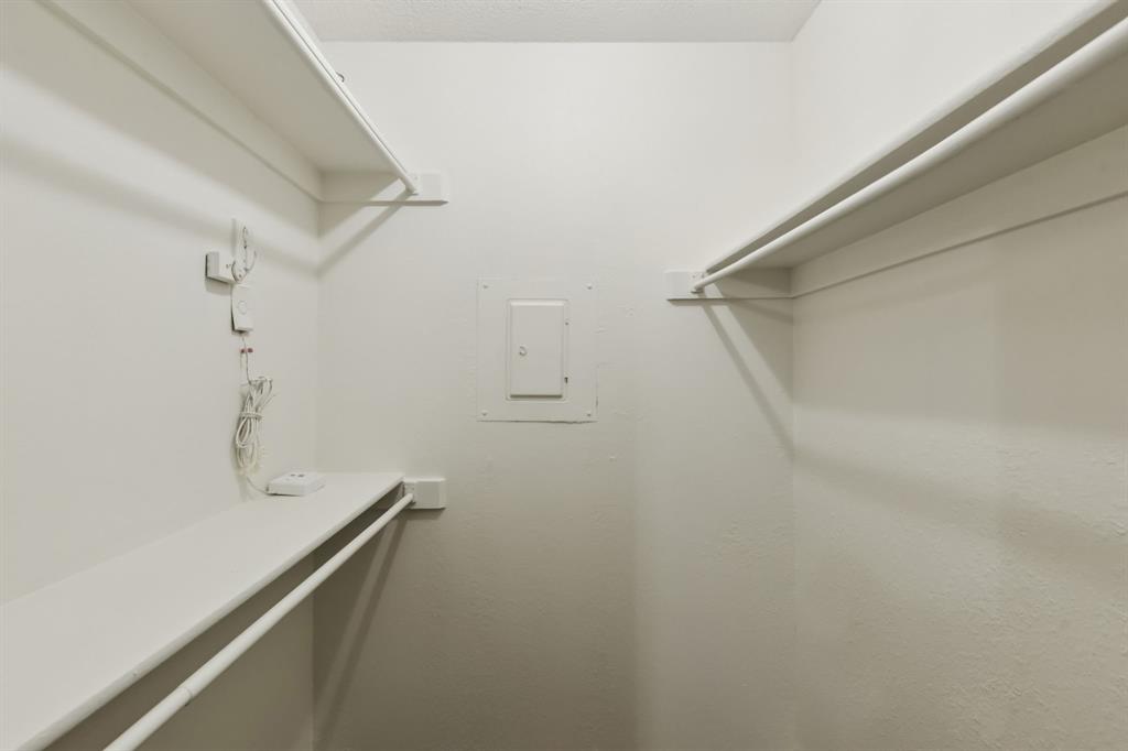 4748 Old Bent Tree Lane, Unit 1808 Dallas, TX 75287 - Photo 16 of 28 a view of a room with racks on the wall