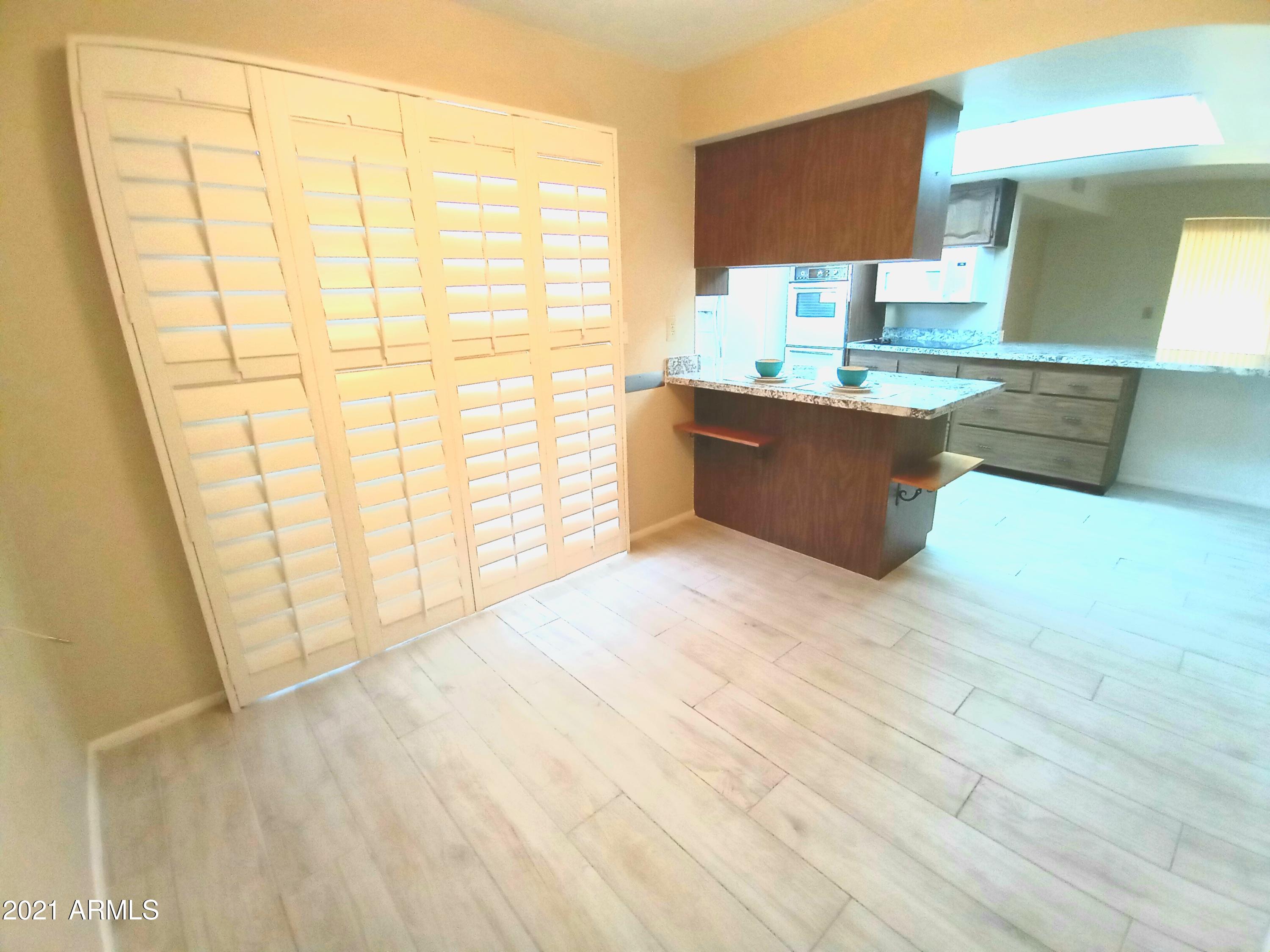 9705 West Oak Ridge Drive Sun City, AZ 85351 - Photo 11 of 35 Breakfast Nook-Shutters Closed