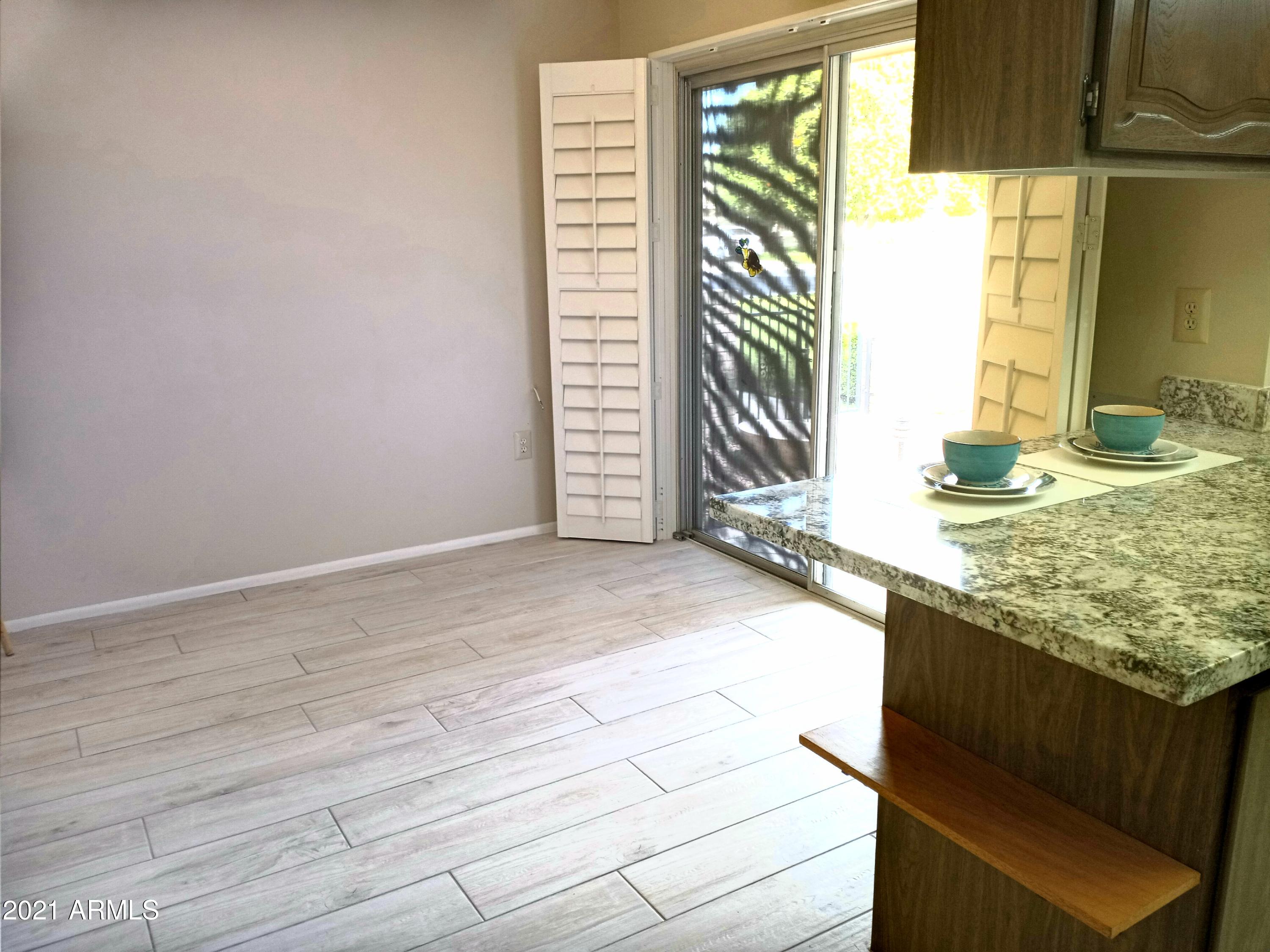 9705 West Oak Ridge Drive Sun City, AZ 85351 - Photo 12 of 35 Breakfast Nook-Shutters Open-Sliding Gla