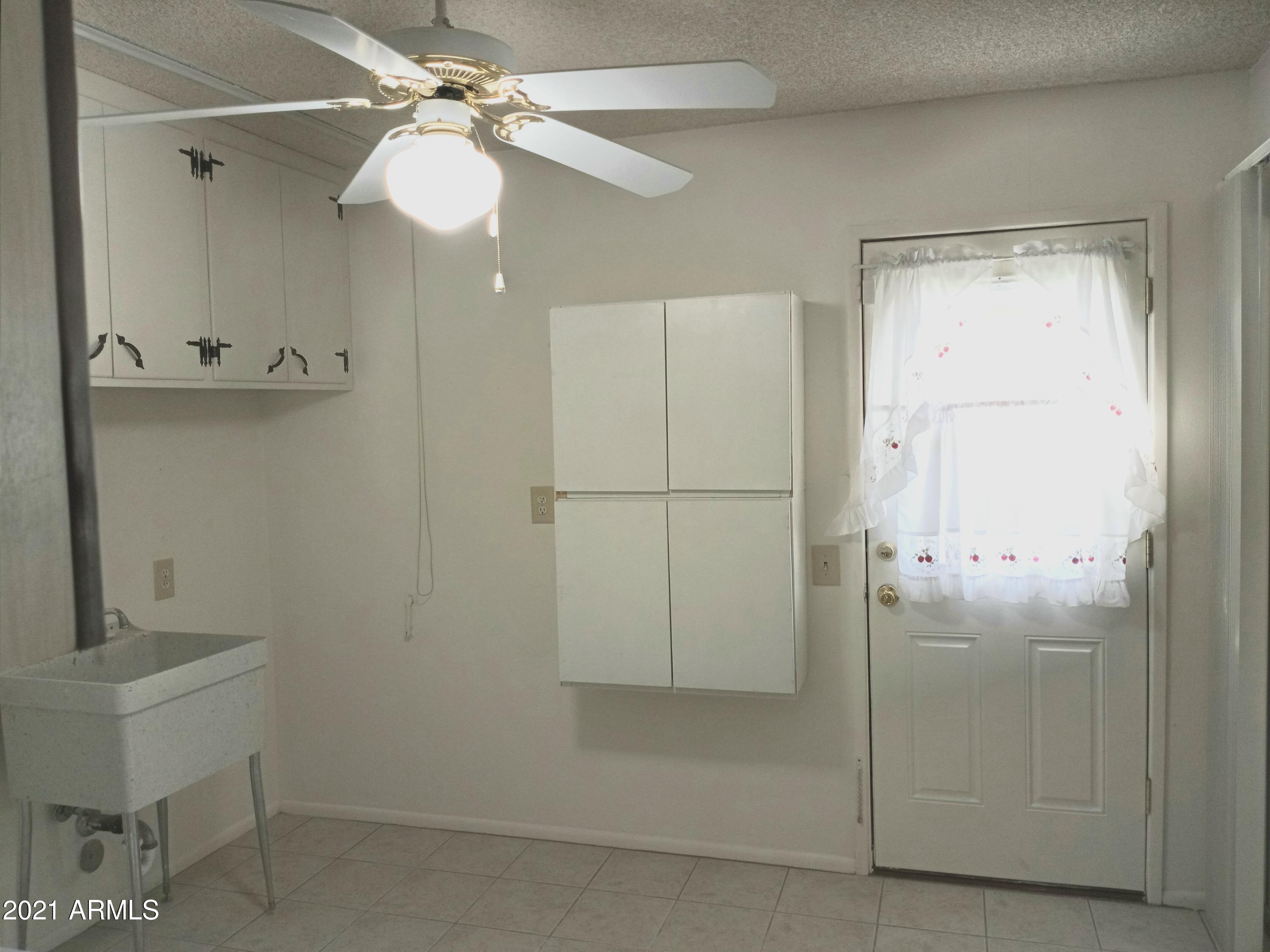 9705 West Oak Ridge Drive Sun City, AZ 85351 - Photo 34 of 35 Laundry Room and Door