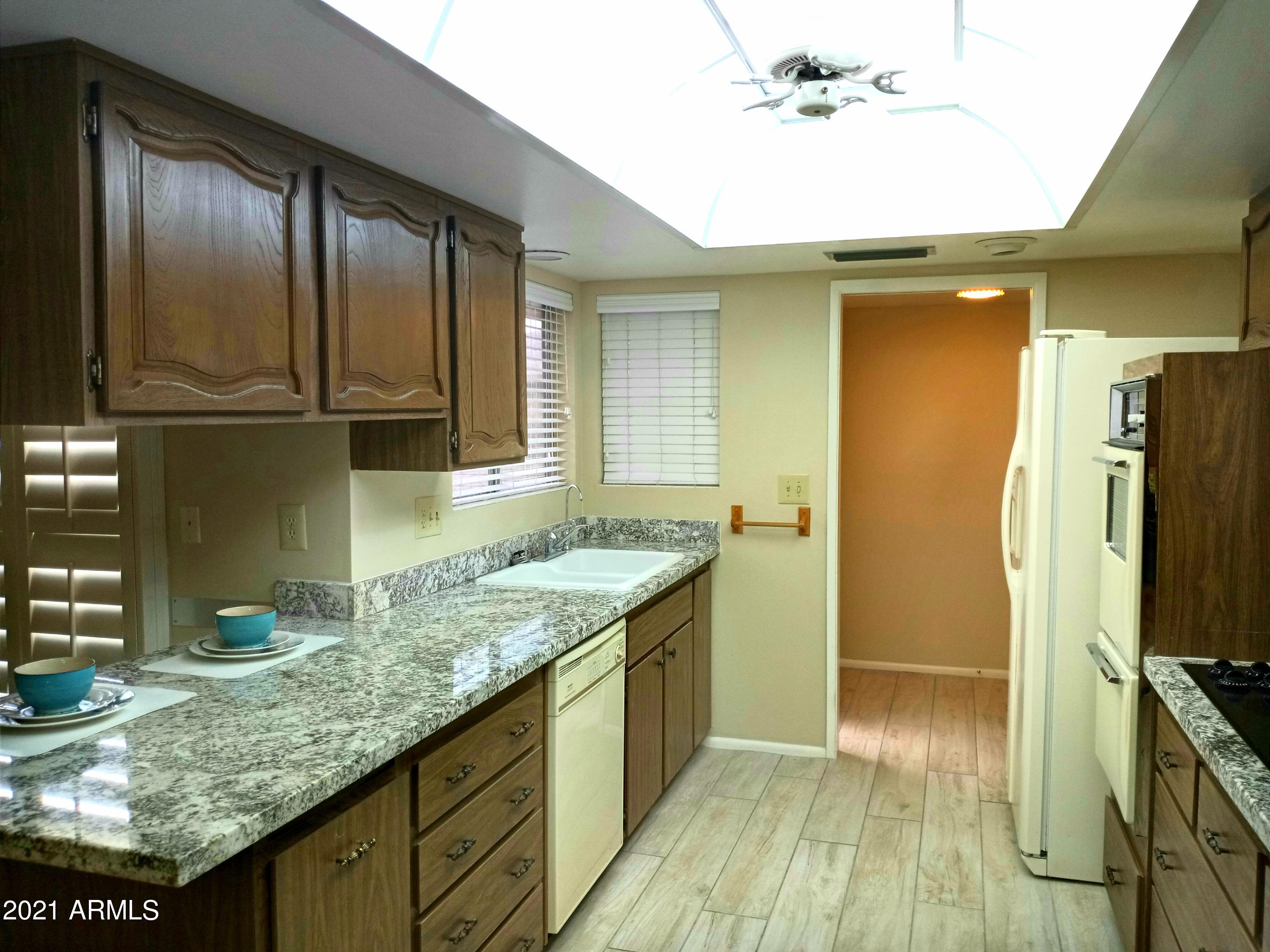 9705 West Oak Ridge Drive Sun City, AZ 85351 - Photo 5 of 35 From Dining Room to Kitchen