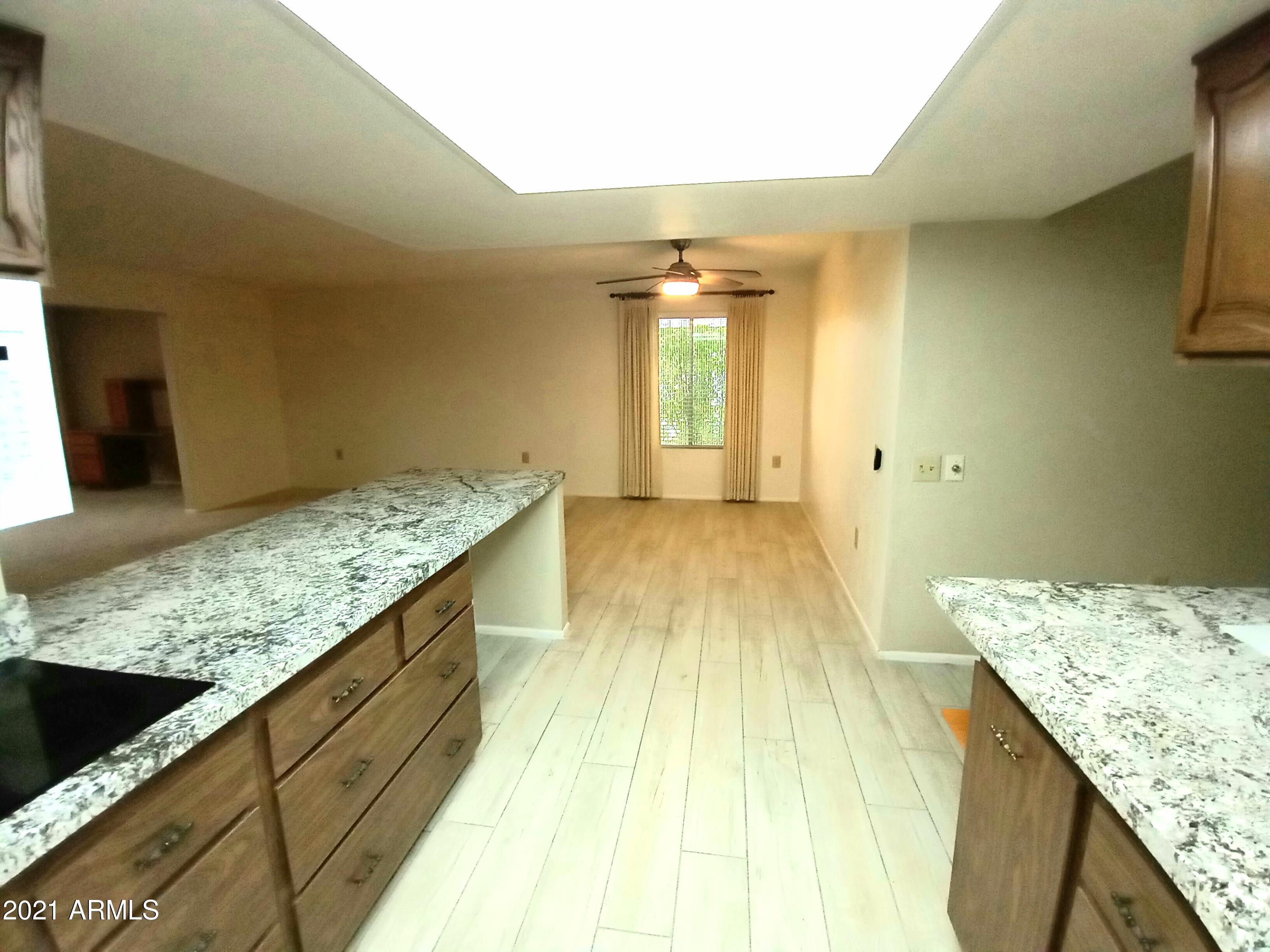 9705 West Oak Ridge Drive Sun City, AZ 85351 - Photo 8 of 35 From Kitchen to Dining Room