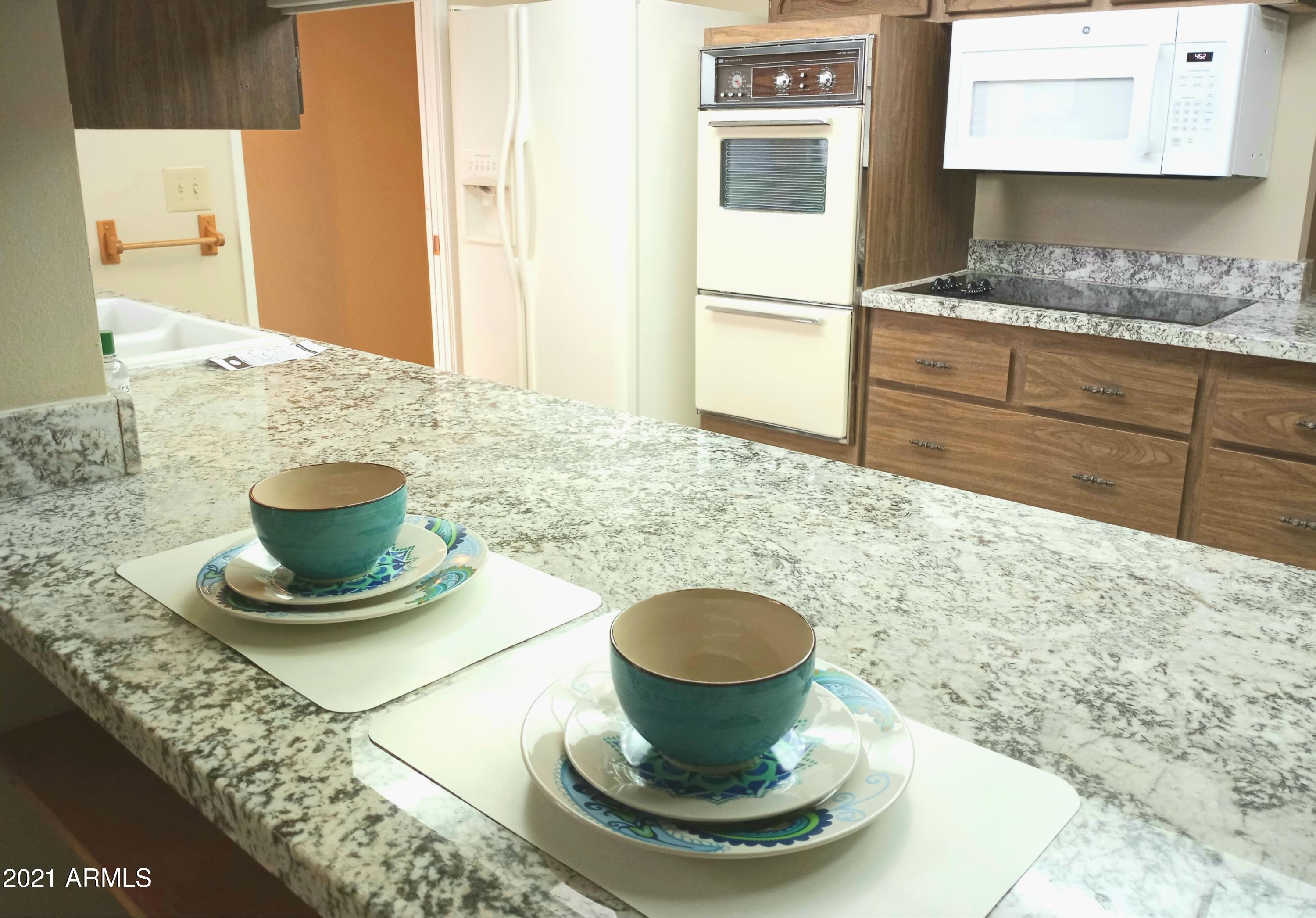 9705 West Oak Ridge Drive Sun City, AZ 85351 - Photo 9 of 35 Breakfast Bar and Kitchen