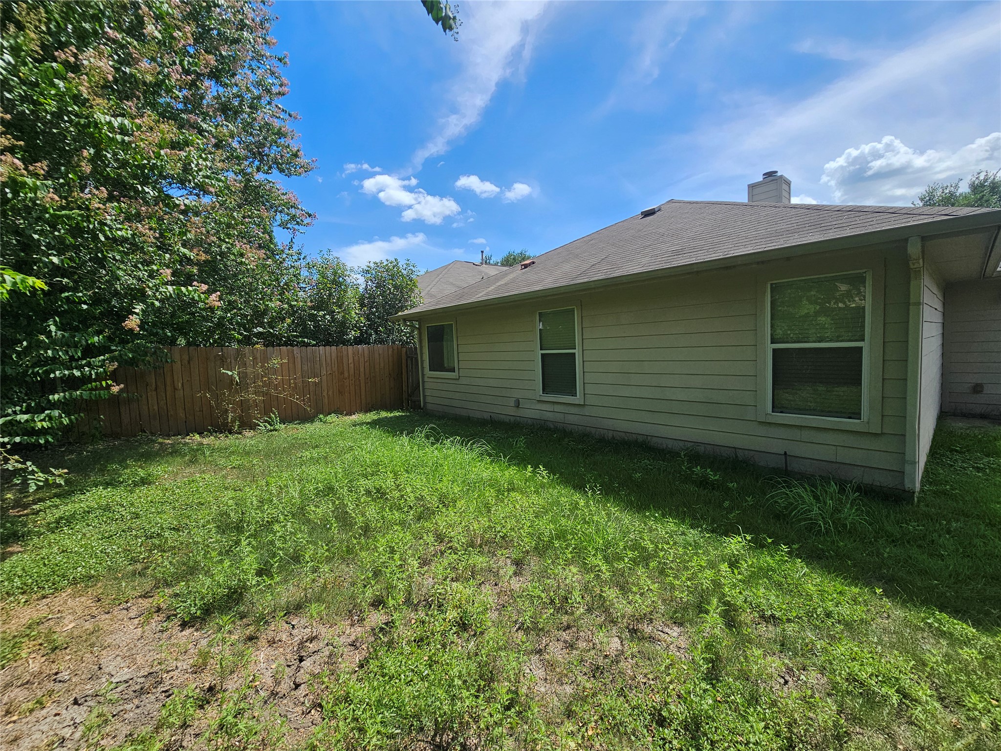2035 Intrepid Drive Buda, TX 78610 - Photo 23 of 26 A private yard with a sturdy fence and ample space for outdoor activities.