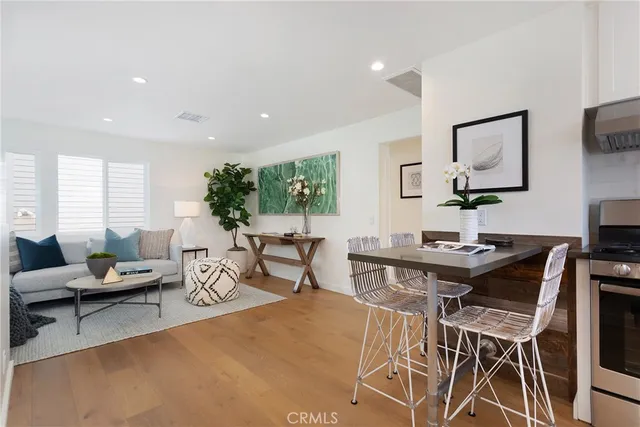 a living room with furniture a rug and a large window