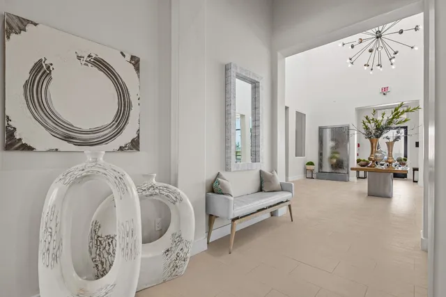 a spacious bedroom with furniture and a large window