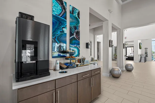 a kitchen with stainless steel appliances a sink and a refrigerator