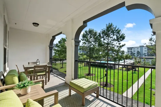 a view of a balcony with lake view and a potted plant