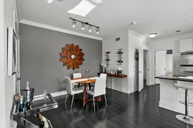 a view of a dining room with furniture and wooden floor