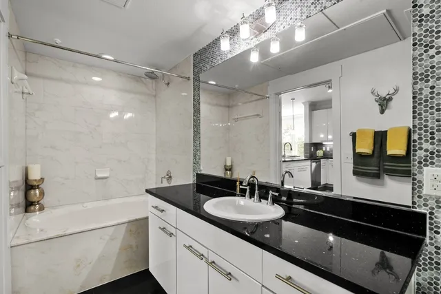 a bathroom with a sink double vanity and a mirror