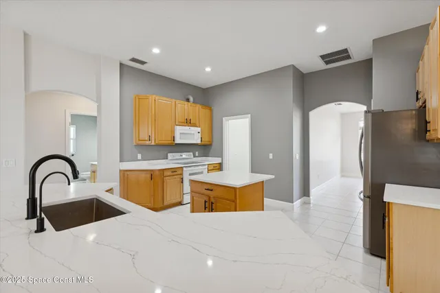 a view of an outdoor space and basketball court