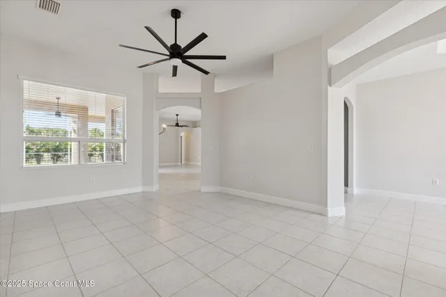 a kitchen with stainless steel appliances granite countertop a refrigerator a sink a stove and island