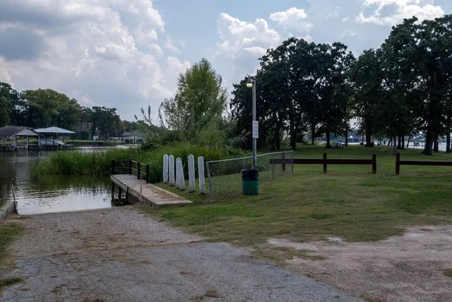 a view of a lake with a garden and trees