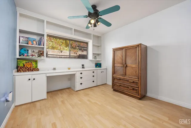 a view of room with cabinet and flat screen tv