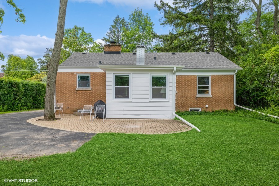 107 Ridge Road Highland Park, IL 60035 - Photo 18 of 20 a front view of house with yard and trees in the background