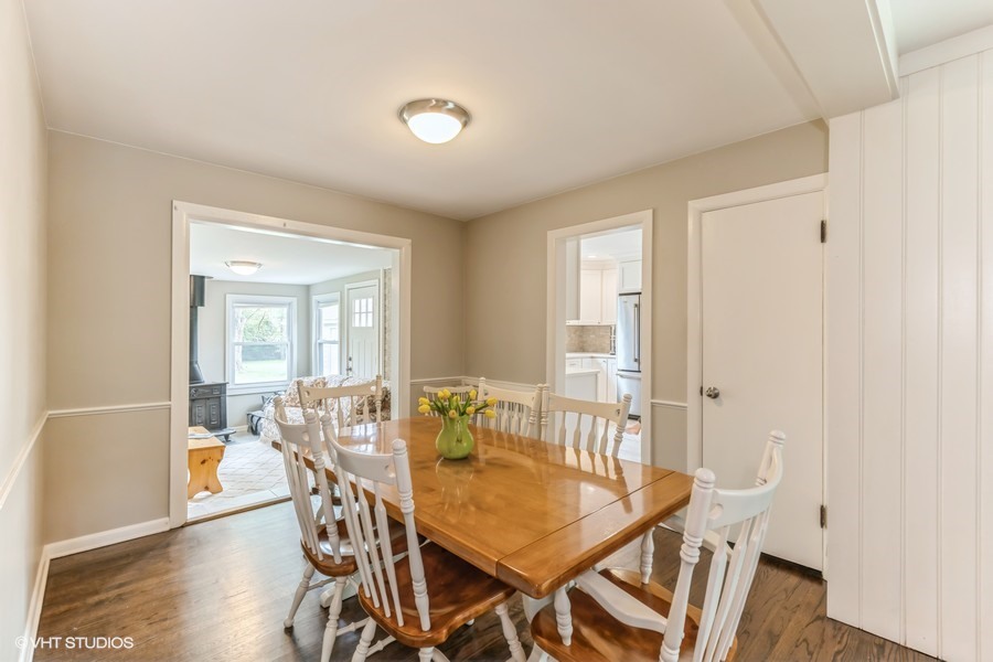 107 Ridge Road Highland Park, IL 60035 - Photo 7 of 20 a view of a dining room with furniture and wooden floor