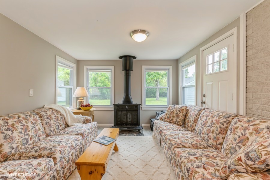 107 Ridge Road Highland Park, IL 60035 - Photo 9 of 20 a living room with furniture and large windows