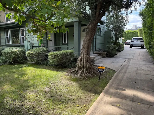 a view of a backyard with sitting area
