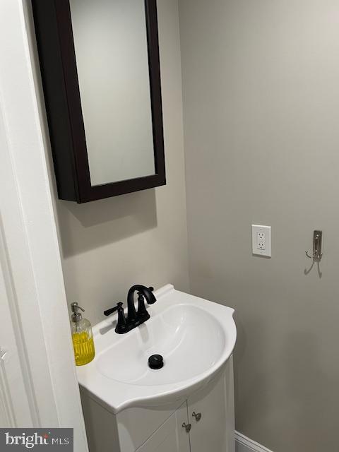 906 I Street Southeast, Unit 2 Washington, DC 20003 - Photo 10 of 14 a bathroom with a sink and a mirror