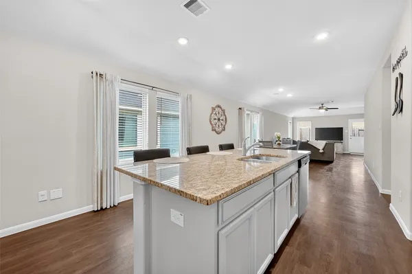 a kitchen with a sink and counter top space