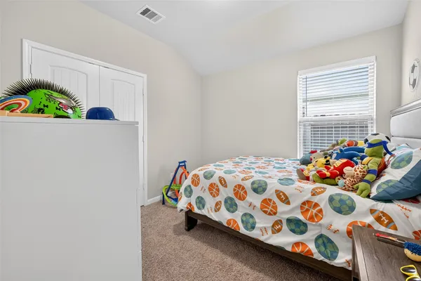 a bedroom with a bed and a small space