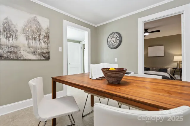 a view of a dining room with furniture and a large window