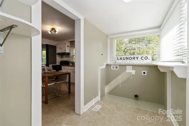 a view of a room that has a bed and a window in it