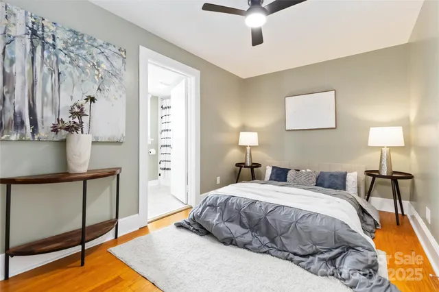 a bedroom with a bed and a lamp on table