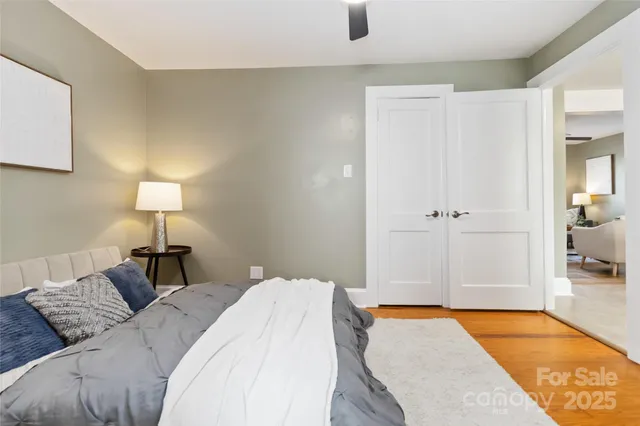 a bedroom with a bed and a lamp