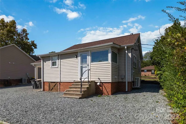 a view of a car parked in front of a house