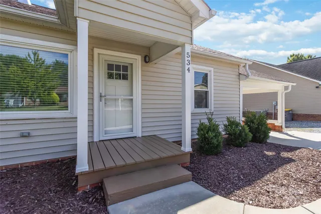 a view of backyard with seating space