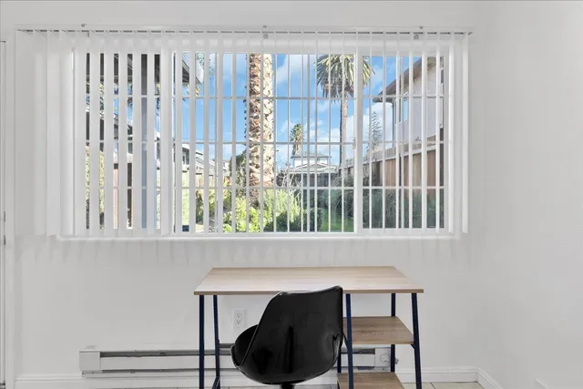a dining room with a table and chairs